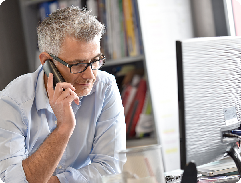 Man on phone at desk